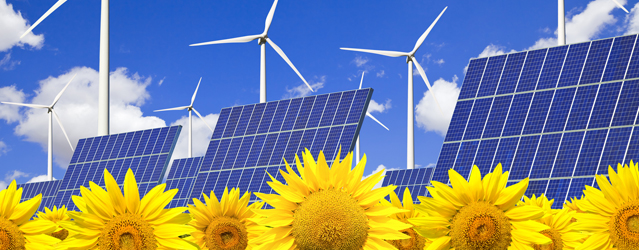 Wind turbines and solar panels on sunflowers field